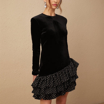 A black velvet mini dress with polka dot print featuring panelled design and ruffled details named Lucrezia