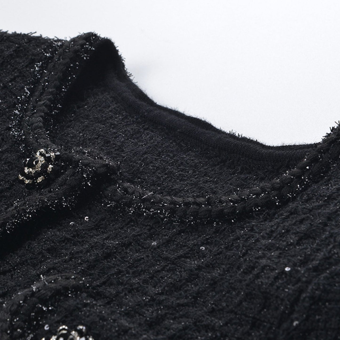 Black waffleknit dress with matching pleated skirt