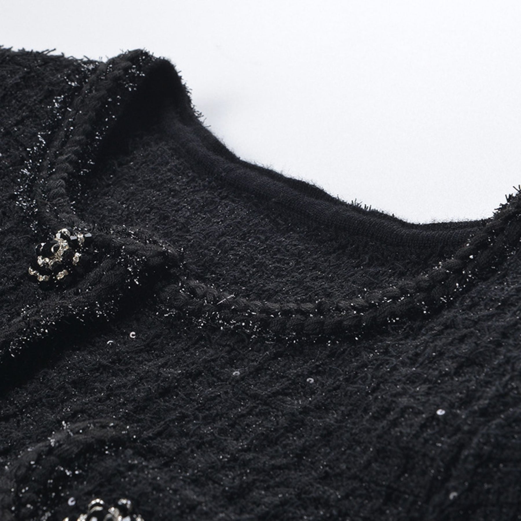 Black waffleknit dress with matching pleated skirt