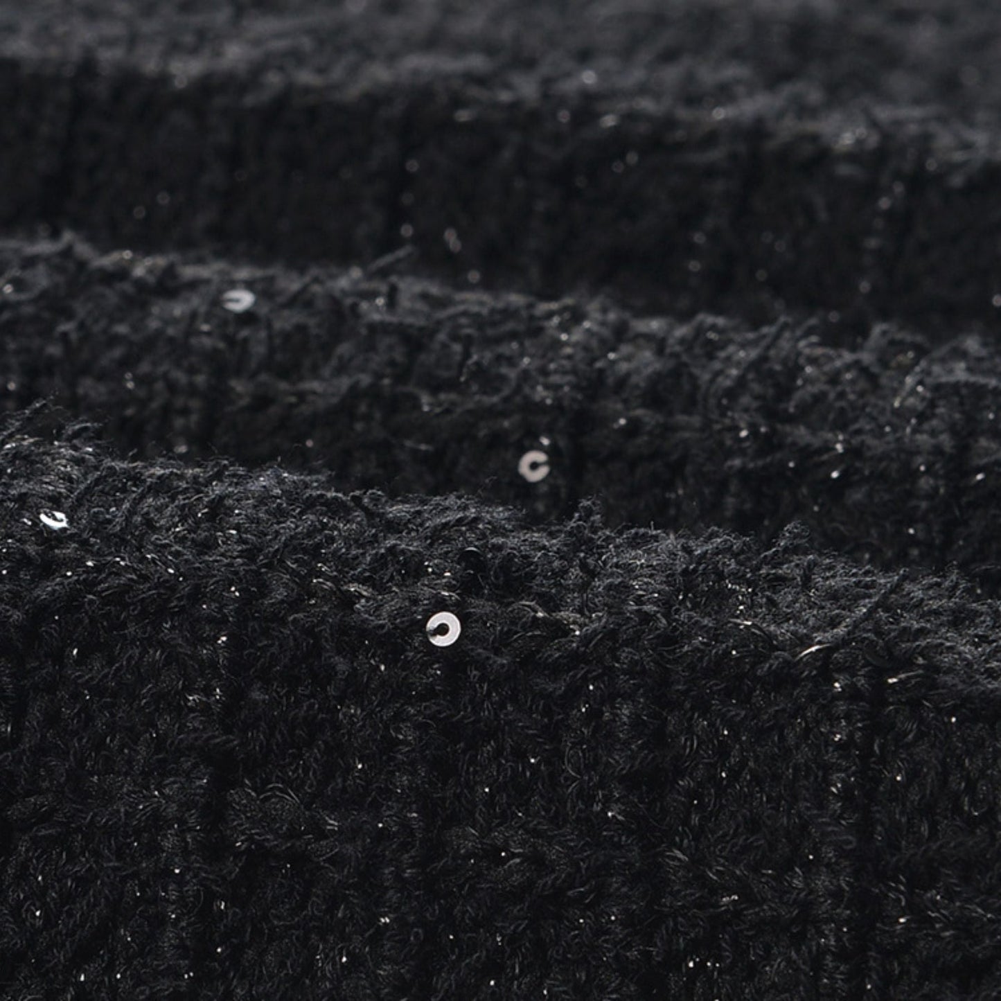 Text Black jacket with long sleeves round neck and four chest flap pockets Front button fastening textured waffleknit 80% Polyester and 20% Cotton composition