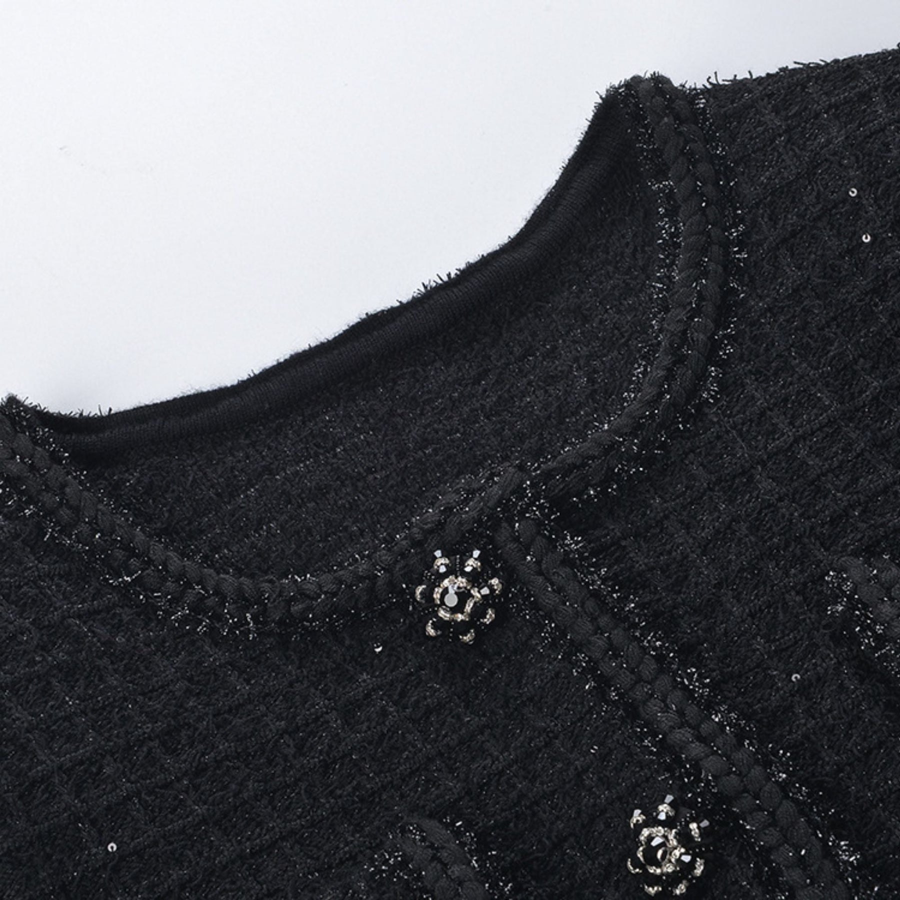 Black waffleknit dress with pleated edge thigh length matching jacket