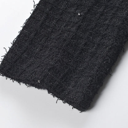Black waffleknit dress with notched lapels long sleeves and front button fastening Made of 80% polyester and 20% cotton