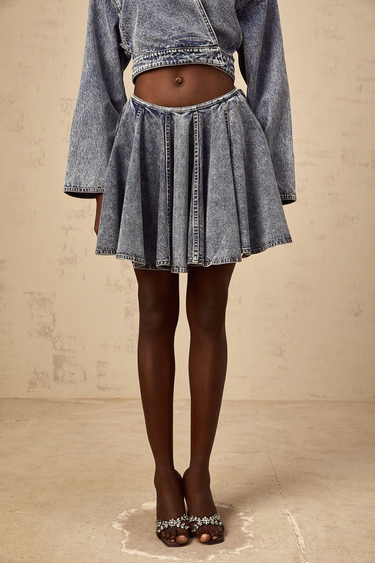 A blue denim mini skirt with shirred detailing named Doriane