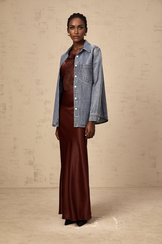 A blue denim shirt with vertical stripes and embellishments featuring the Josephine design