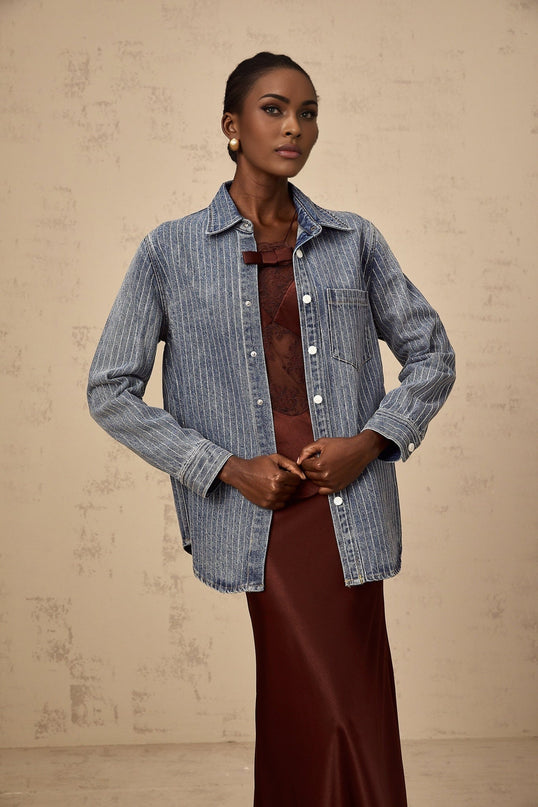 A blue denim shirt with vertical stripes and embellishments named Josephine