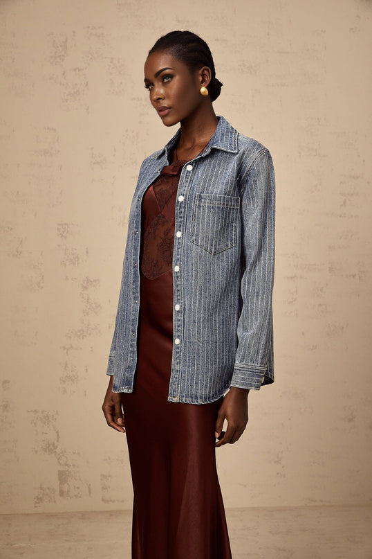 A blue denim shirt with vertical stripes and embellishments named Josephine