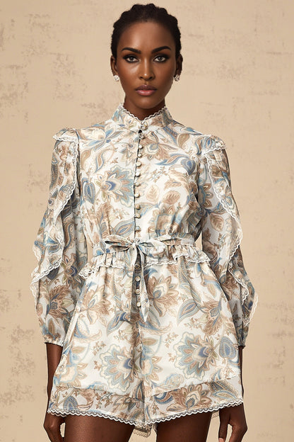 A blue floral print jumpsuit with ruffles and lace trim details named Eugenie
