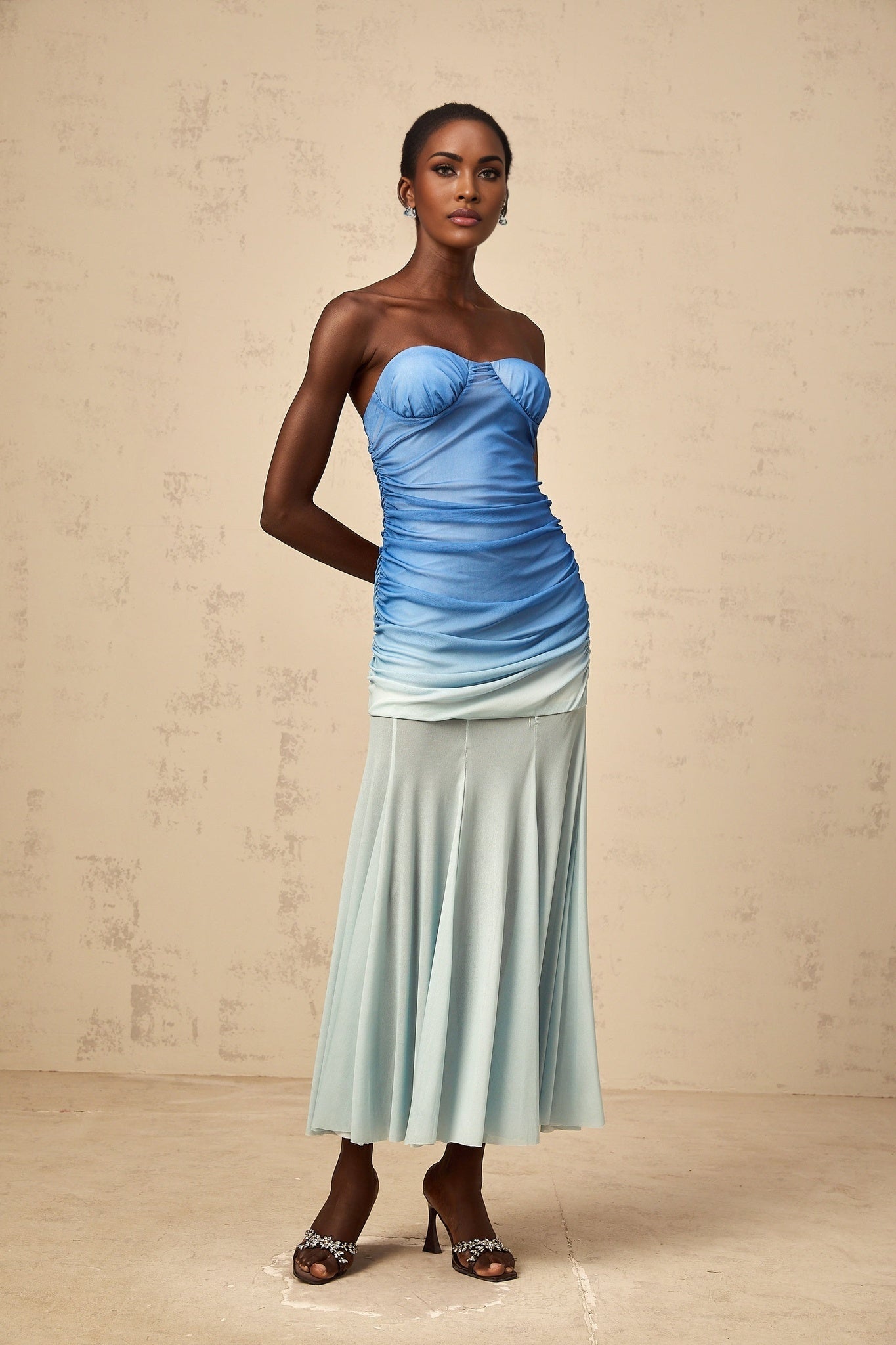 A blue gradient mesh midi dress with a flowing silhouette and sheer overlay