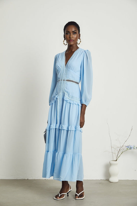 A blue maxi dress named Juno featuring cutouts and ruffles