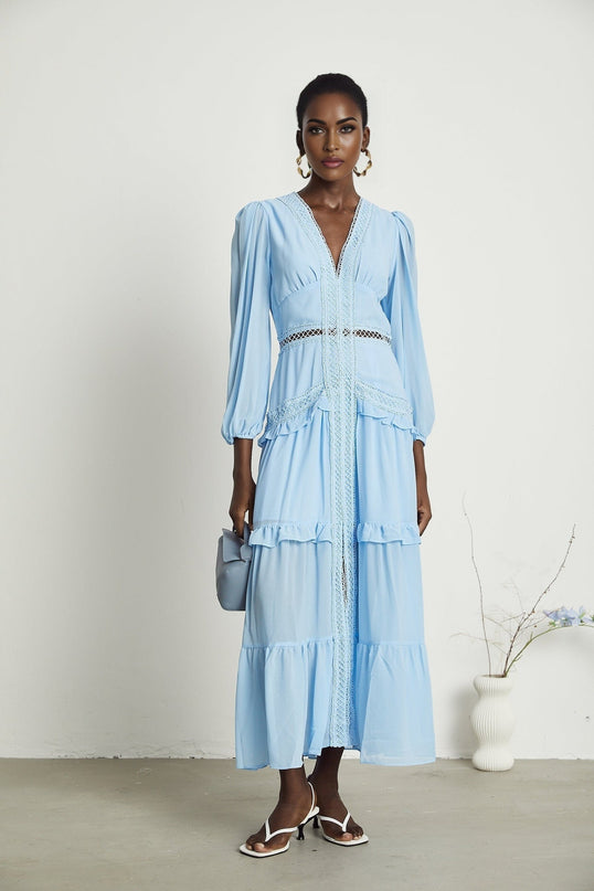 A blue maxi dress named Juno featuring cutouts and ruffles