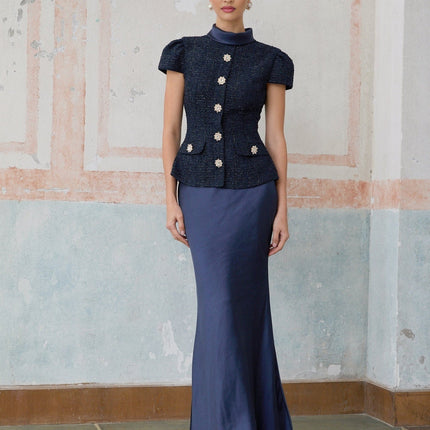 A blue maxi dress with a peplum waist and paneled design named Josette