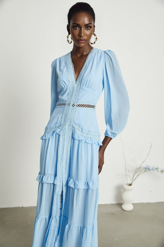 A blue maxi dress with cutouts and ruffles named Juno