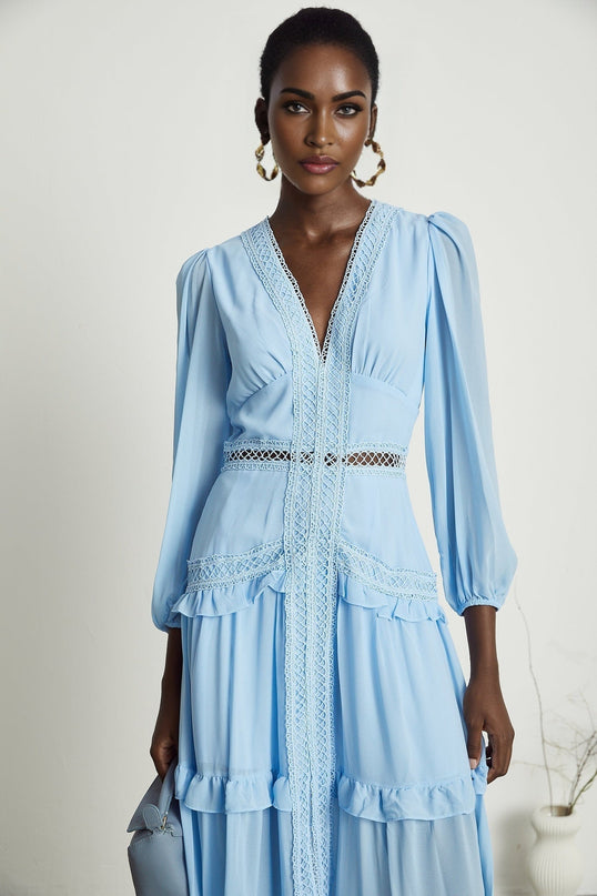 A blue maxi dress with cutouts and ruffles named Juno