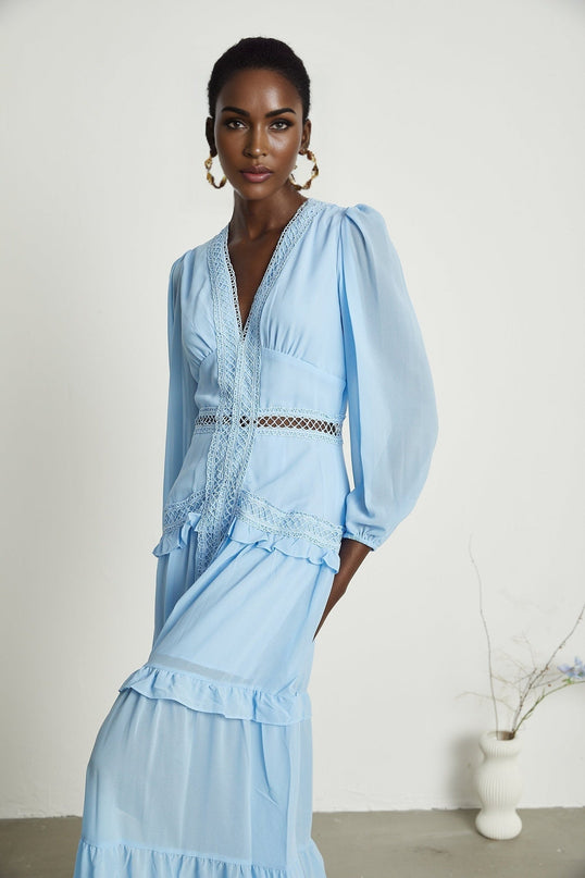 A blue maxi dress with cutouts and ruffles named Juno