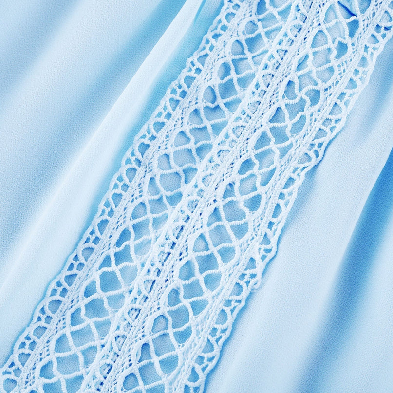 A blue maxi dress with cutouts and ruffles named Juno