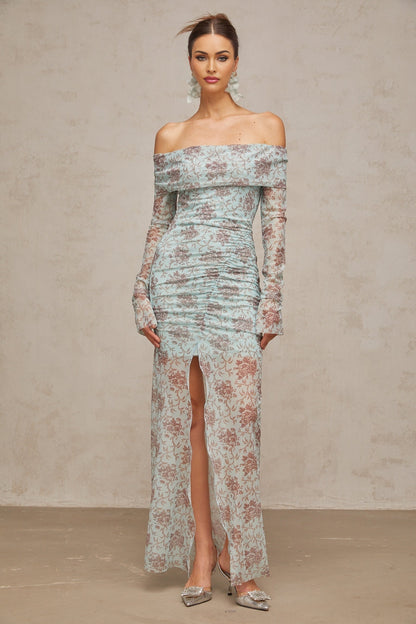 A blue maxi dress with floral print pattern and ruched detailing by Honorine