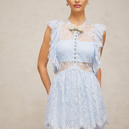 A blue maxi dress with layered lace details and a capucine style featuring a long flowing skirt and delicate lace overlay