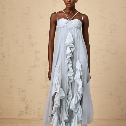 A blue maxi dress with layered ruffled tulle skirt and sleeveless bodice featuring a feminine silhouette and flowing design
