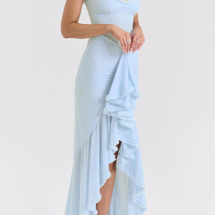 A blue maxi dress with ruffle details and draped fabric featuring a long flowing silhouette