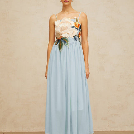 A blue maxi dress with shirred detailing and floral embroidery called Josette
