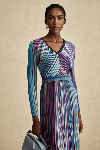 A blue metallic pleated midi dress with a feminine silhouette named Mathilde