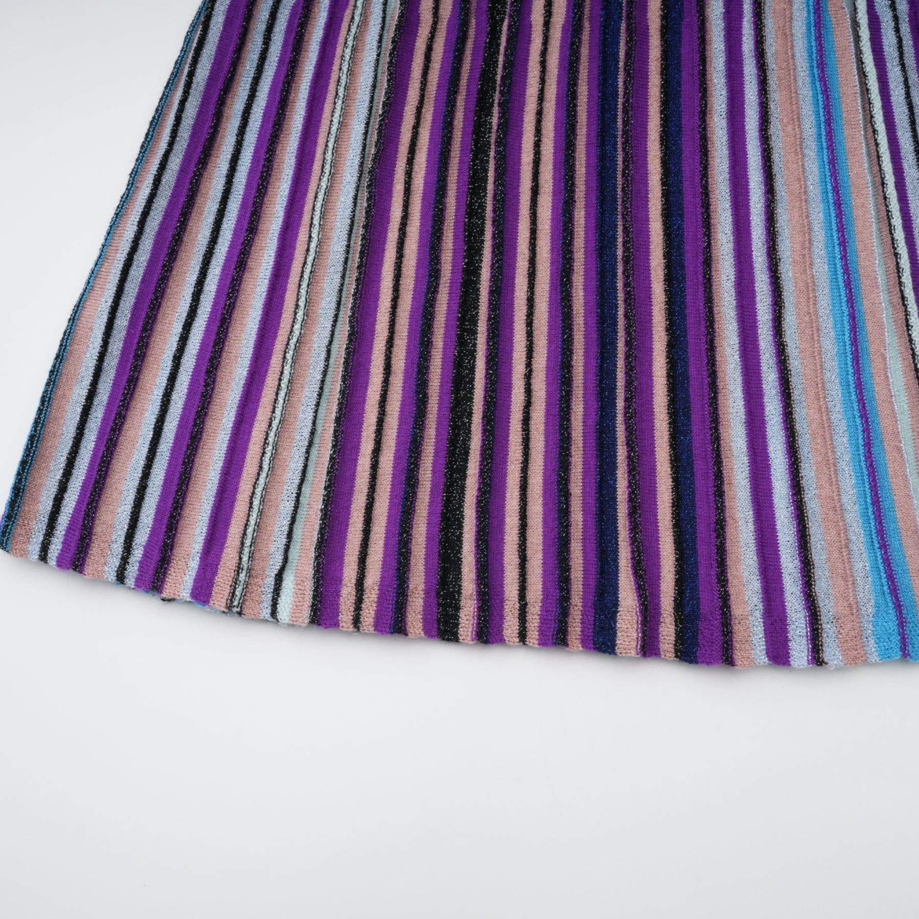 A blue metallic pleated midi dress with a flowing skirt and shimmering fabric named Mathilde
