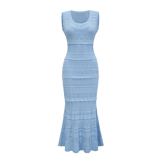 A blue midi dress with crochet knit detailing and ruffled trim featuring a sleeveless design and fitted silhouette