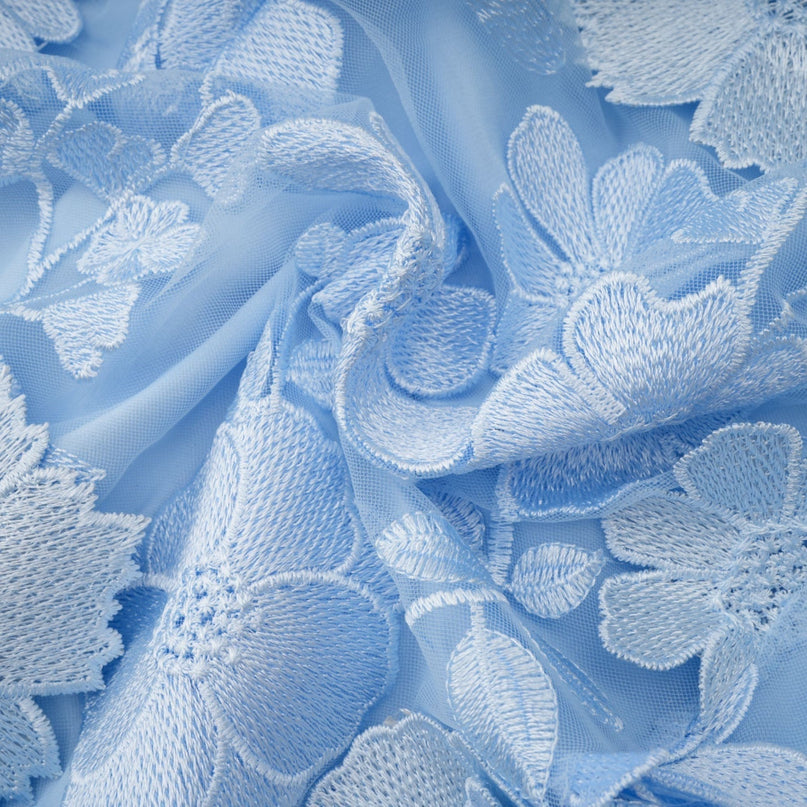 A blue midi dress with floral applique details by Herta