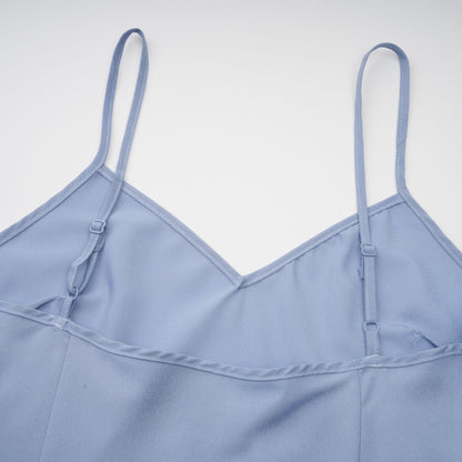 A blue midi dress with floral lace applique details and a delicate feminine design