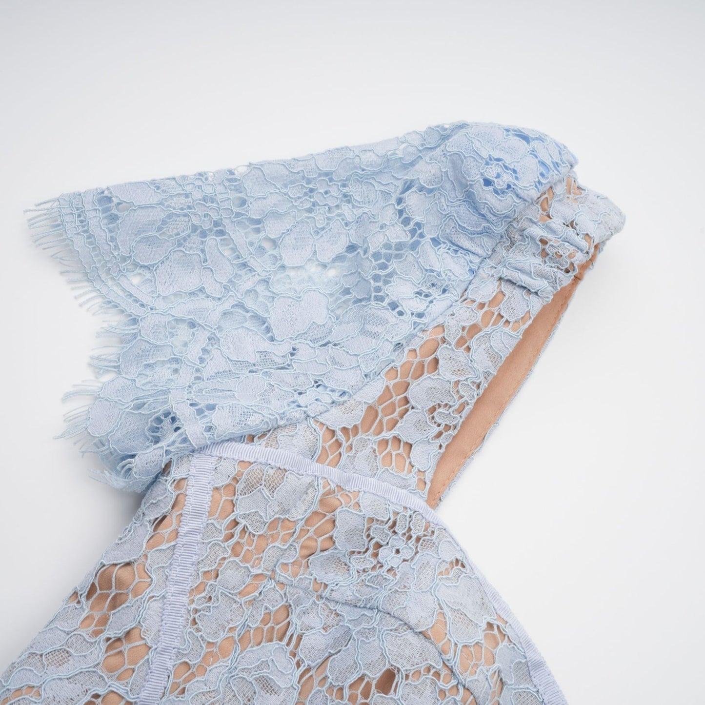A blue midi dress with floral lace pattern and boned structure named Audrey