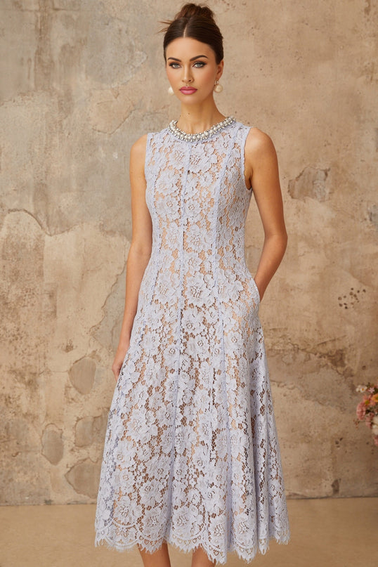 A blue midi dress with floral lace pattern and embellishments featuring a fitted silhouette and delicate details