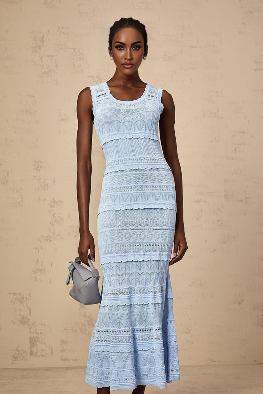 A blue midi dress with ruffled trim and crochet knit design featuring a flowing silhouette and delicate texture