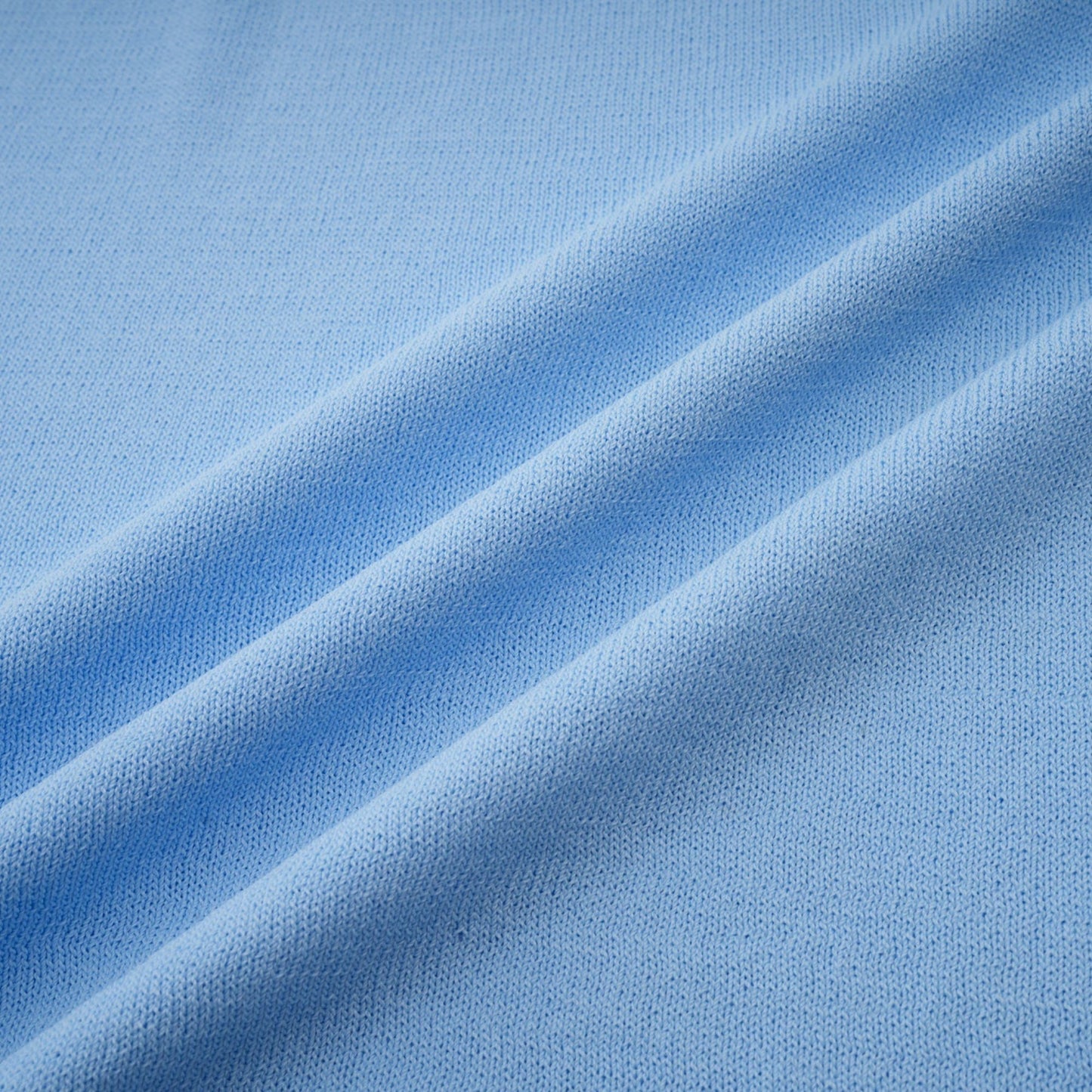 A blue midi dress with ruffled trim and crochet knit pattern featuring a delicate design and feminine silhouette