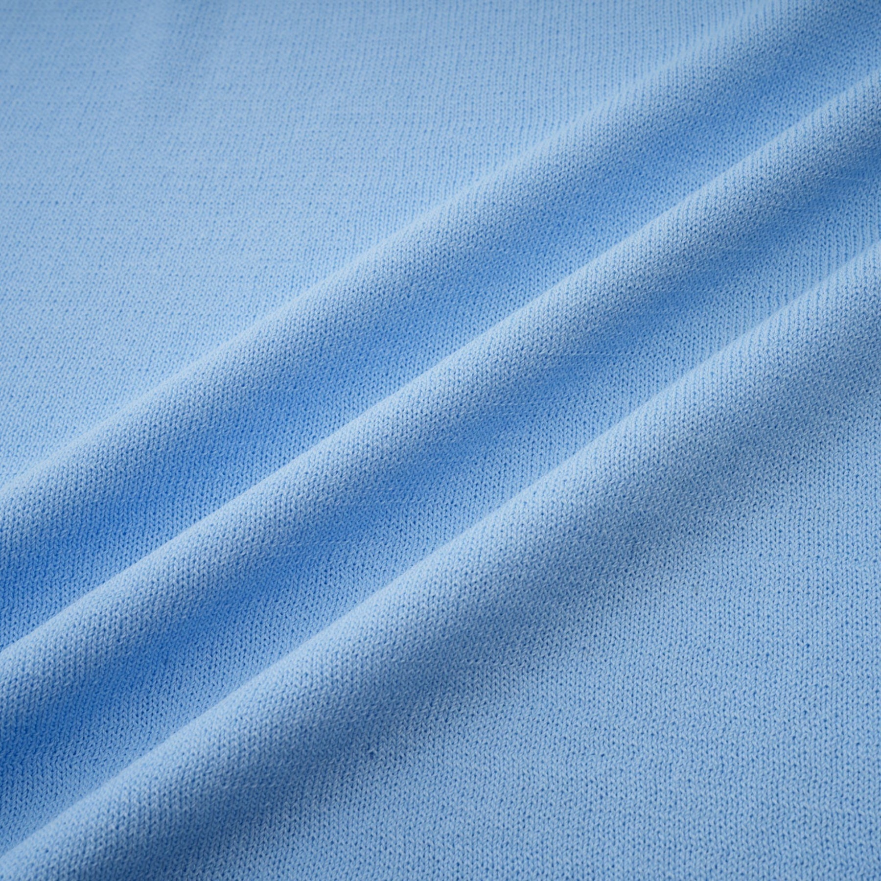 A blue midi dress with ruffled trim and crochet knit pattern featuring a delicate design and feminine silhouette