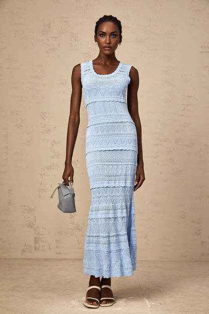 A blue midi dress with ruffled trim and crochet knit pattern featuring a feminine silhouette and delicate details