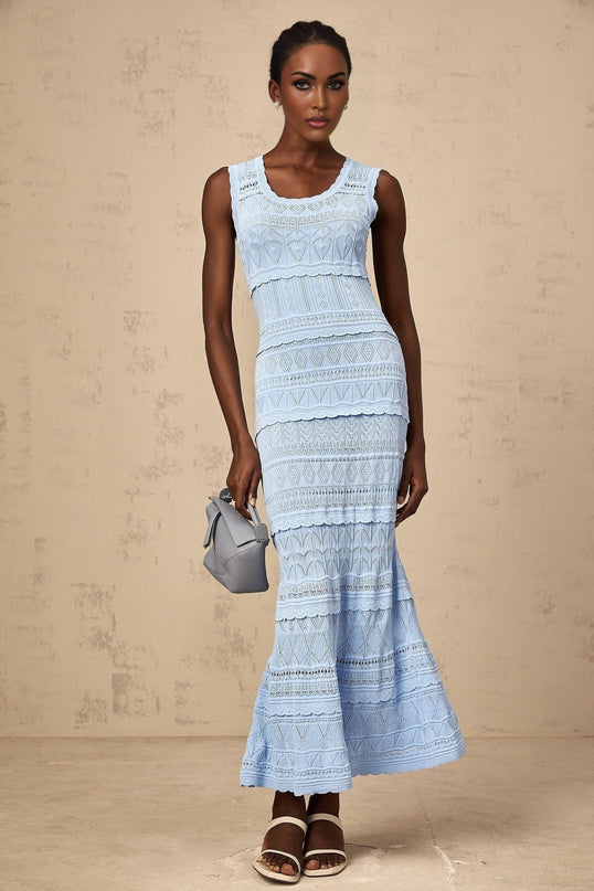 A blue midi dress with ruffled trim and crochet knit pattern featuring a feminine silhouette