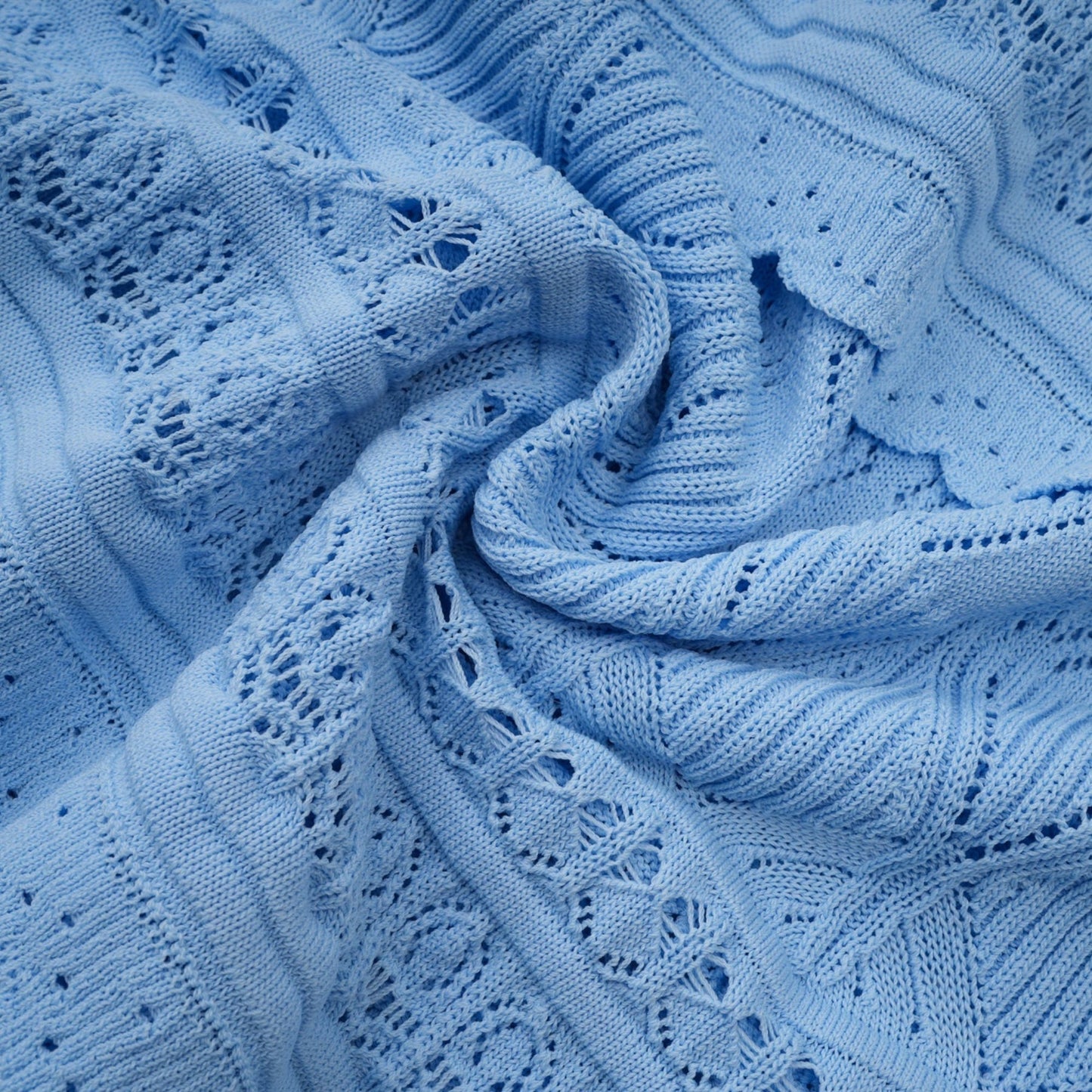 A blue midi dress with ruffled trim and crochet knit pattern