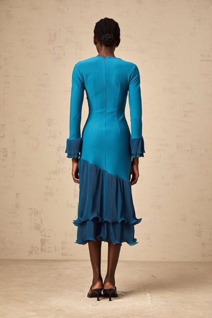 A blue midi dress with ruffled trim and paneled design featuring a flowy silhouette and feminine details