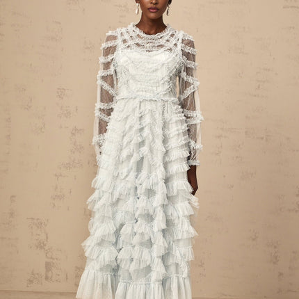 A blue midi dress with ruffles and small dot details named Adelaide