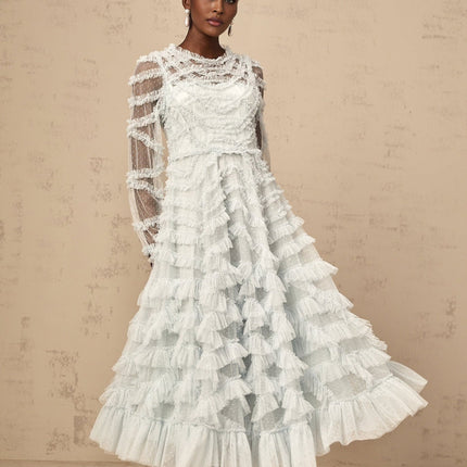 A blue midi dress with ruffles and small dot details named Adelaide