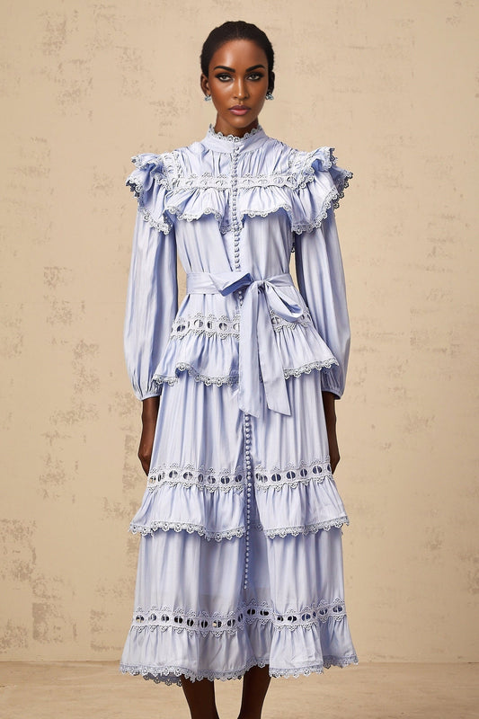 A blue midi dress with tiered layers and lace trim details named Veronique
