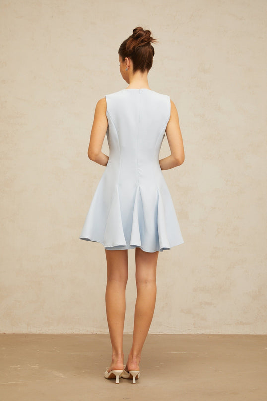 A blue mini dress with a bowknot detail and godet design featuring a flared skirt silhouette