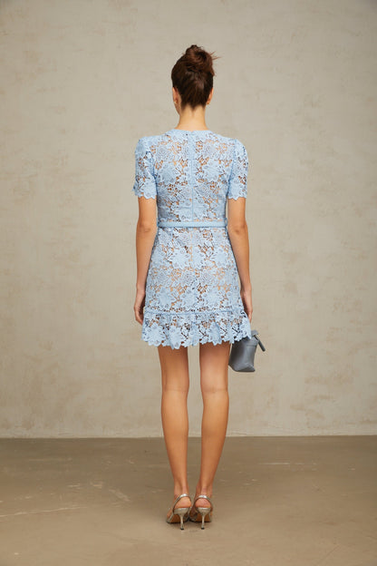 A blue mini dress with floral applique and ruffled lace details featuring a feminine design with a short hemline