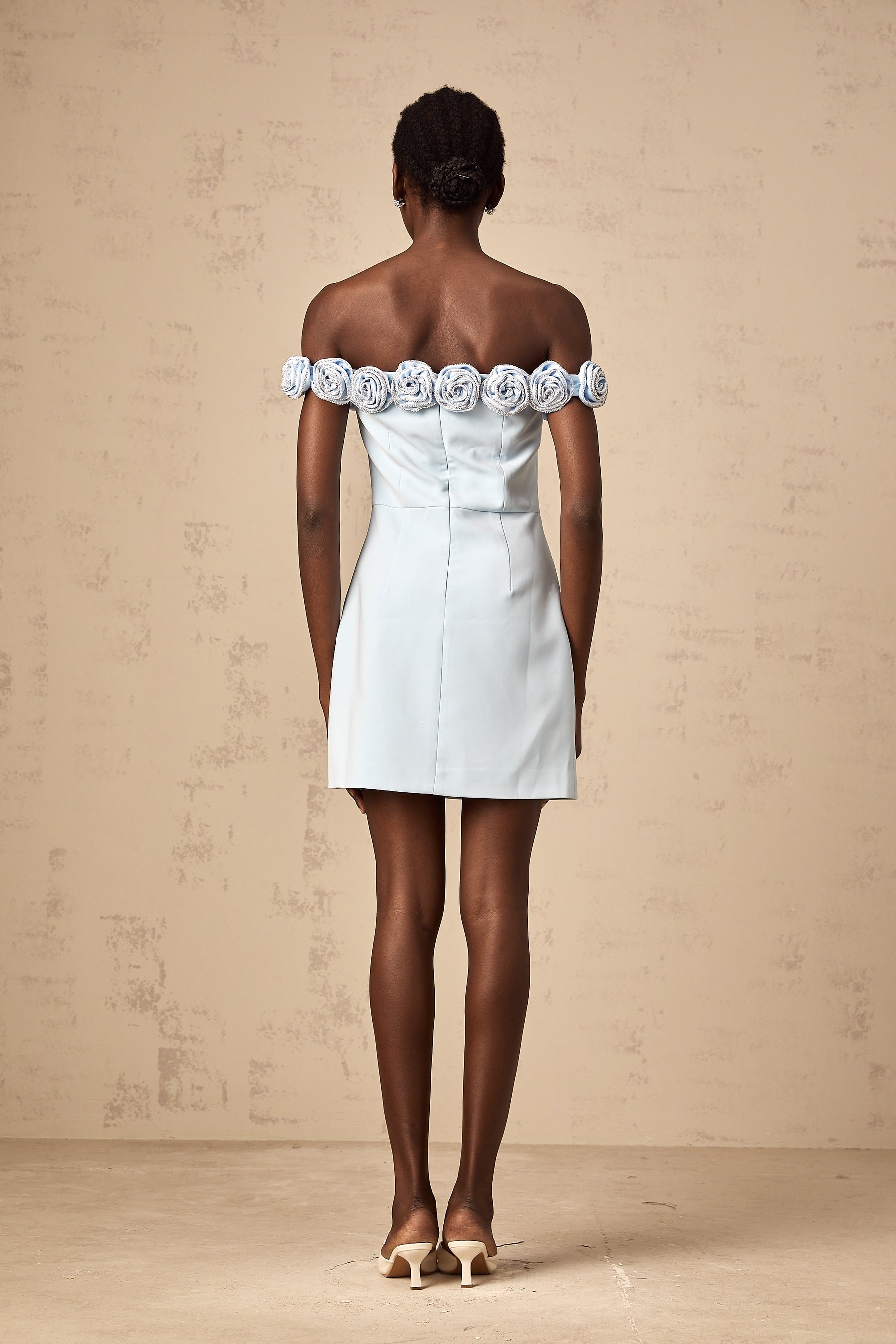 A blue mini dress with floral applique details named Hedwige