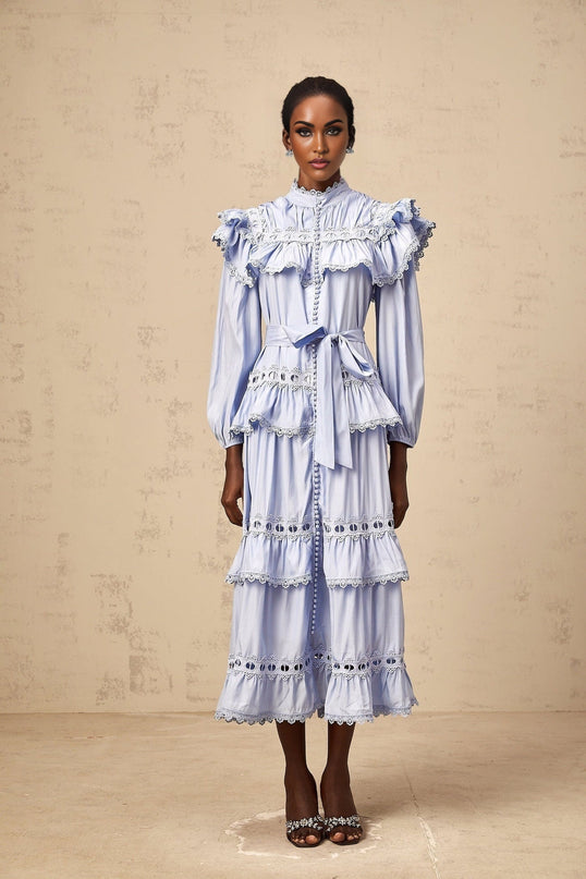 A blue tiered midi dress with lace trim details named Veronique