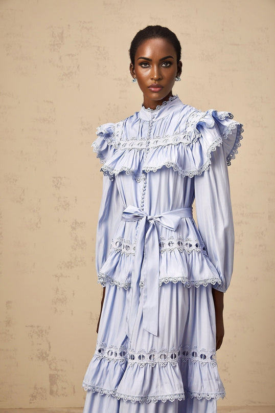 A blue tiered midi dress with lace trim details named Veronique