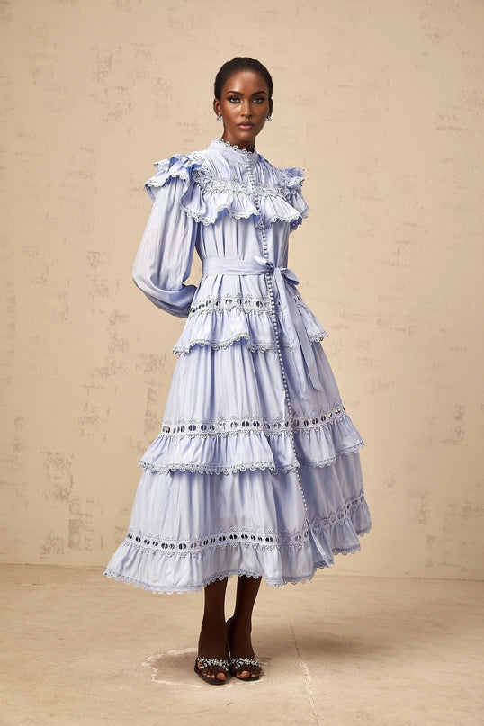 A blue tiered midi dress with lace trim details named Veronique