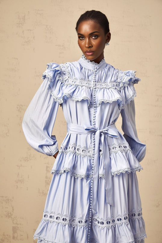 A blue tiered midi dress with lace trim details named Veronique
