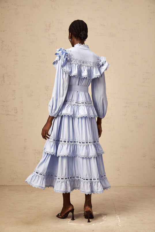 A blue tiered midi dress with lace trim details named Veronique