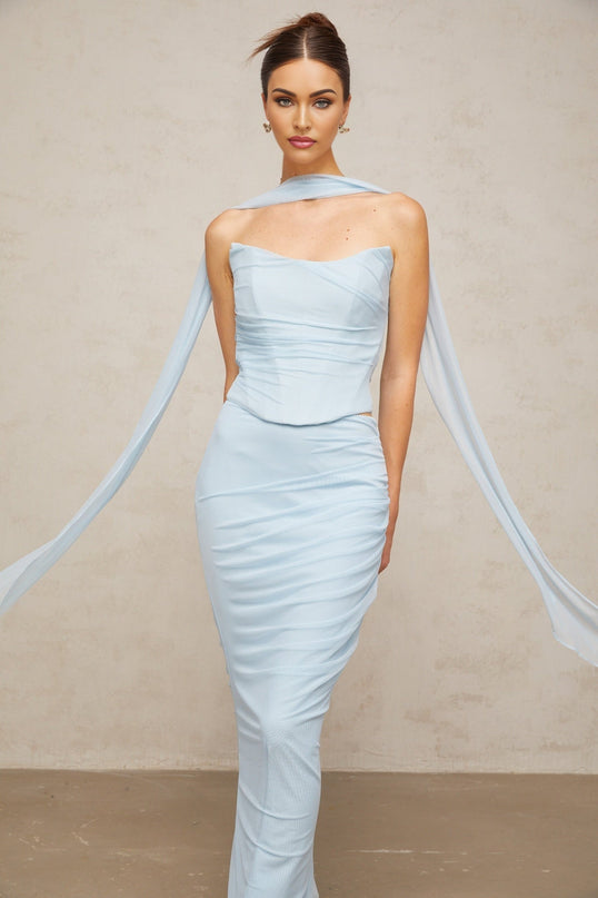 A blue twopiece outfit featuring a ruched tulle top and matching skirt set named Lea